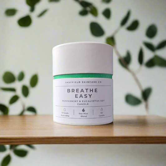 Candle jar labeled 'Breathe Easy' by Sheffield Skincare Co on a white background
