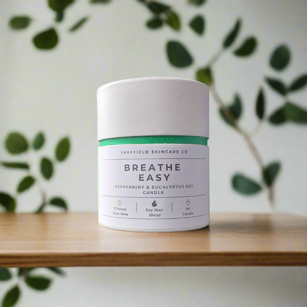 Candle jar labeled 'Breathe Easy' by Sheffield Skincare Co on a white background